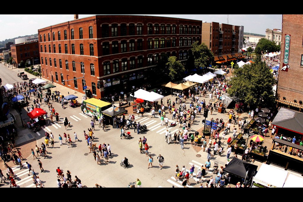 The Downtown Farmers' Market filling Court Avenue on a Saturday morning, seen from above