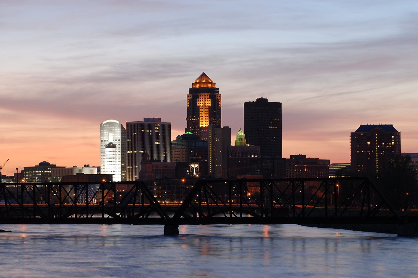 The downtown Des Moines skyline at dusk over the Des Moines River