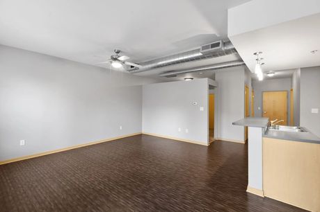An open living space near the unit's entry hallway